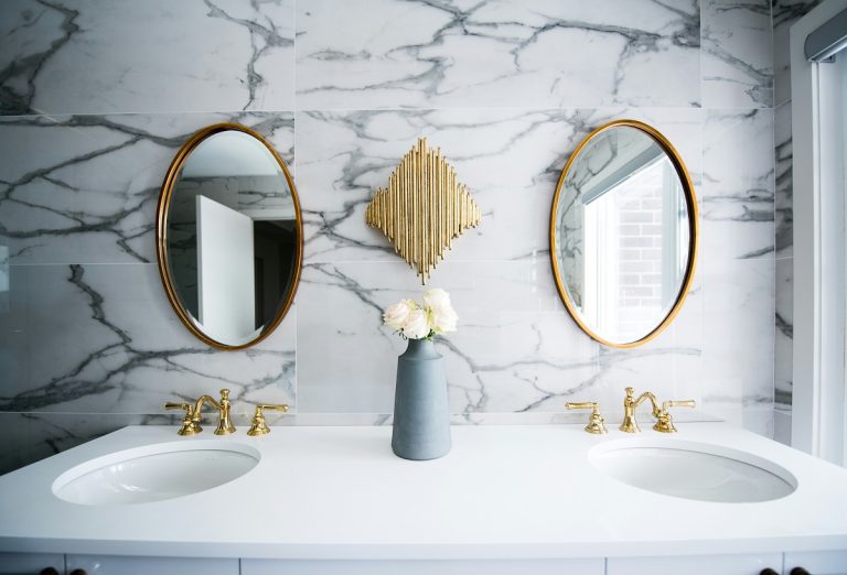 two bathroom mirrors above two sinks